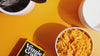 Macaroni noodles being boiled and prepared to make Macaroni and Cheese dish, served in a white bowl